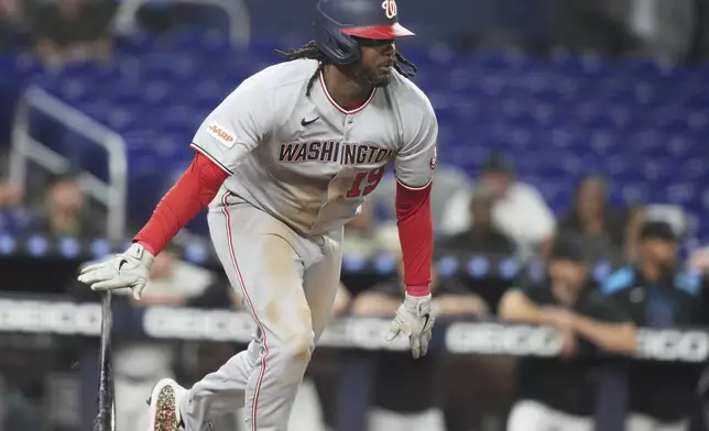 Washington Nationals' Josh Bell runs after hitting a RBI single to score CJ Abrams during the fifth inning of a baseball game against the Miami Marlins, Monday, Sept. 8, 2025, in Miami. (AP Photo/Lynne Sladky)