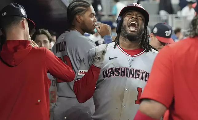 Washington Nationals' Josh Bell (19) reacts after hitting a two run home run during the seventh inning of a baseball game against the Miami Marlins, Monday, Sept. 8, 2025, in Miami. (AP Photo/Lynne Sladky)