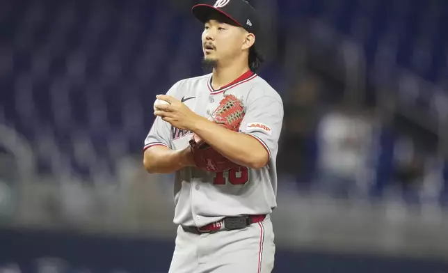 Washington Nationals relief pitcher Shinnosuke Ogasawara (16), of Japan, stands on the mound after giving up a solo home run to Miami Marlins' Jakob Marsee during the ninth inning of a baseball game, Monday, Sept. 8, 2025, in Miami. (AP Photo/Lynne Sladky)
