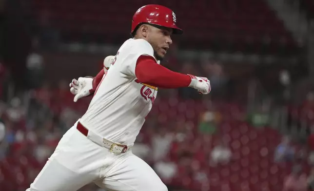 St. Louis Cardinals' Willson Contreras rounds first on a two-run single before being thrown out as second trying to stretch the hit into a double during the third inning of a baseball game against the Athletics Wednesday, Sept. 3, 2025, in St. Louis. (AP Photo/Jeff Roberson)