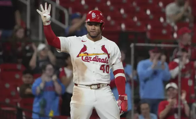 St. Louis Cardinals' Willson Contreras celebrates after hitting a two-run triple during the eighth inning of a baseball game against the Athletics Wednesday, Sept. 3, 2025, in St. Louis. (AP Photo/Jeff Roberson)