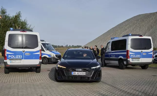 Lawyer Friedrich Fuelscher arrives in a black car at the prison where Christian B., a suspect in the 2007 disappearance of British toddler Madeleine McCann, is serving a prison sentence in an unrelated case and is expected to be released in Sehnde, Germany, Wednesday, Sept. 17, 2025. (AP Photo/Markus Schreiber)