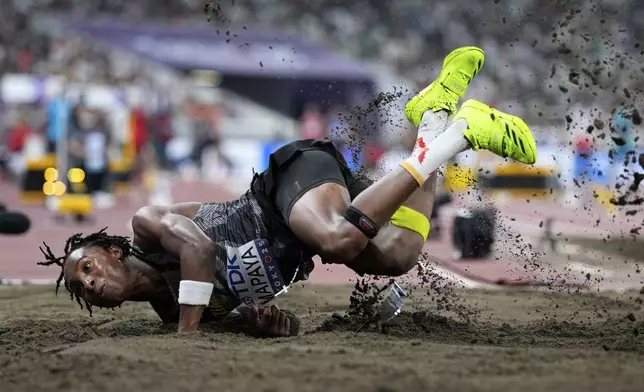 Zimbabwe's Chengetayi Mapaya makes an attempt in the men's triple jump qualification at the World Athletics Championships in Tokyo, Wednesday, Sept. 17, 2025. (AP Photo/Matthias Schrader)