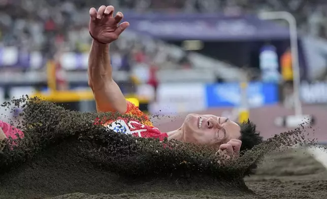 China's Zhang Mingkun competes in the men's long jump final at the World Athletics Championships in Tokyo, Wednesday, Sept. 17, 2025. (AP Photo/Ashley Landis)