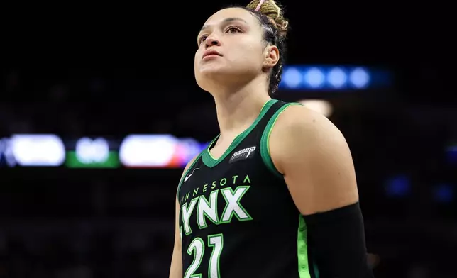 Minnesota Lynx guard Kayla McBride reacts during overtime of Game 2 of a WNBA basketball playoff semifinals series against the Phoenix Mercury Tuesday, Sept. 23, 2025, in Minneapolis. (AP Photo/Matt Krohn)