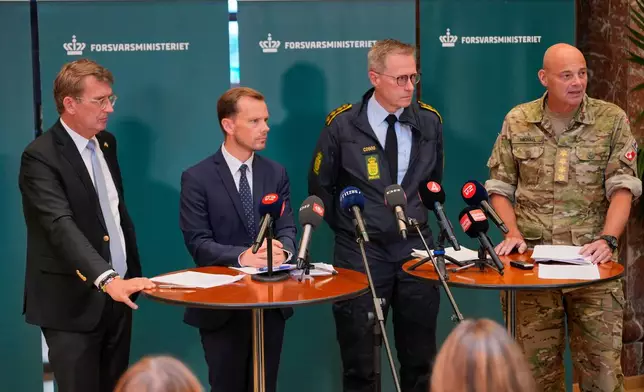 From left, Danish Minister of Defence Troels Lund Poulsen, Danish Minister of Justice Peter Hummelgaard, Chief of Police Thorkild Fogde, and Chief of Defense Michael Hyldgaard hold a press conference to provide an update on the recent drone activities at several airports in Denmark, at the Ministry of Defence in Copenhagen, Thursday, Sept. 25, 2025. (Emil Helms/Ritzau Scanpix via AP)