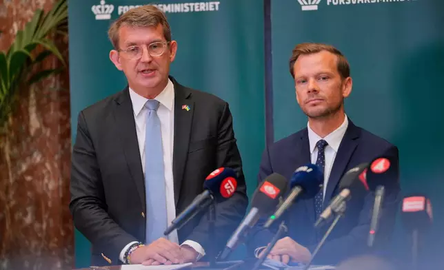 Danish Minister of Defence Troels Lund Poulsen, left, and Danish Minister of Justice Peter Hummelgaard hold a press conference to provide an update on the recent drone activities at several airports in Denmark, at the Ministry of Defence in Copenhagen, Thursday, Sept. 25, 2025. (Emil Helms/Ritzau Scanpix via AP)