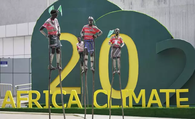 Artists walk on stilts during the Second Africa Climate Summit (ACS2) in Addis Ababa, Ethiopia, Monday, September 8, 2025. (AP Photo/Brian Inganga)
