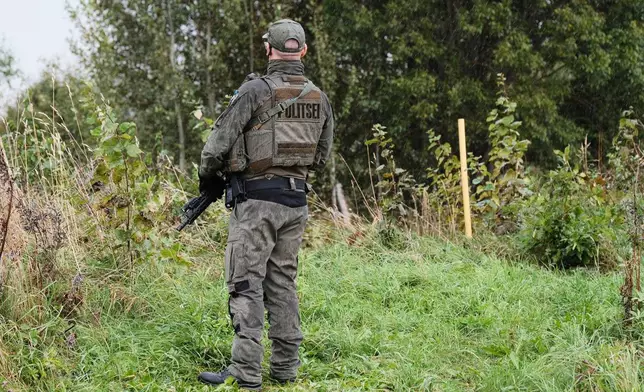 An Estonian border guard patrols the Russian border near Vinski, Estonia, Monday, Sept. 15, 2025. (AP Photo/Hendrik Osula)