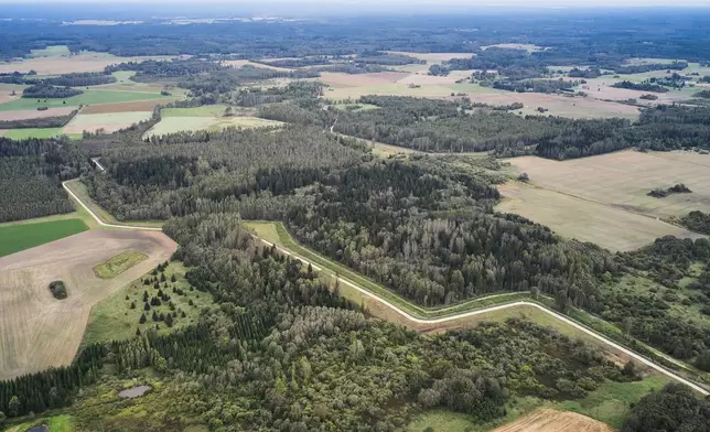 A drone shows an aerial view of the Estonia-Russia border near Vinski, Estonia, Monday, Sept. 15, 2025. (AP Photo/Hendrik Osula)