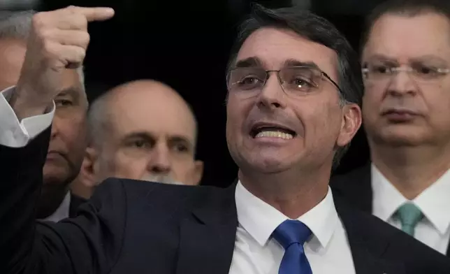 Senator Flavio Bolsonaro, the son of former President Jair Bolsonaro, speaks during a press conference about his father's trial, in Brasilia, Brazil, Tuesday, Sept. 9, 2025. (AP Photo/Eraldo Peres)