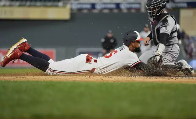 Minnesota Twins' Byron Buxton (25) is tagged out by Chicago White Sox catcher Edgar Quero during the fifth inning of a baseball game Wednesday, Sept. 3, 2025, in Minneapolis. (AP Photo/Abbie Parr)
