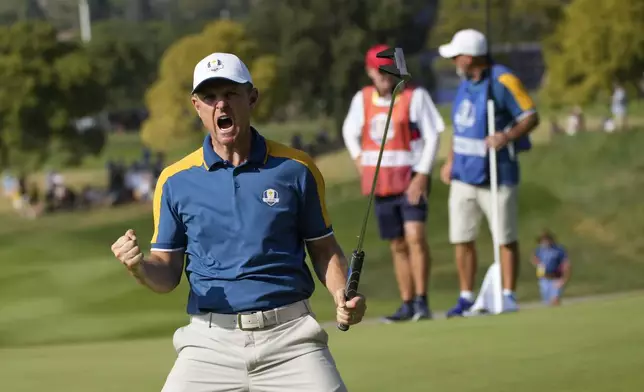 FILE - Europe's Justin Rose celebrates on the 15th green during his singles match at the Ryder Cup golf tournament at the Marco Simone Golf Club in Guidonia Montecelio, Italy, Sunday, Oct. 1, 2023. (AP Photo/Alessandra Tarantino)