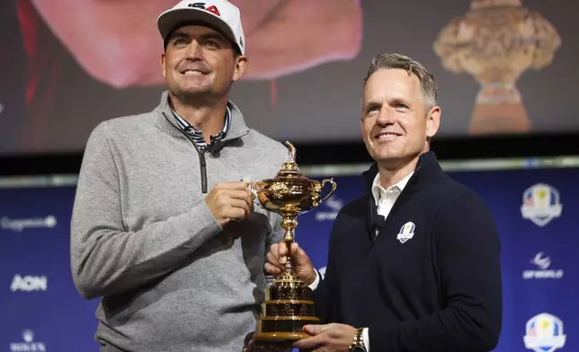 FILE - United States captain Keegan Bradley, left, and Europe captain Luke Donald pose for a photo with the Ryder Cup trophy after a press conference in New York, Tuesday, Oct. 8, 2024, in New York. (AP Photo/Heather Khalifa, File(