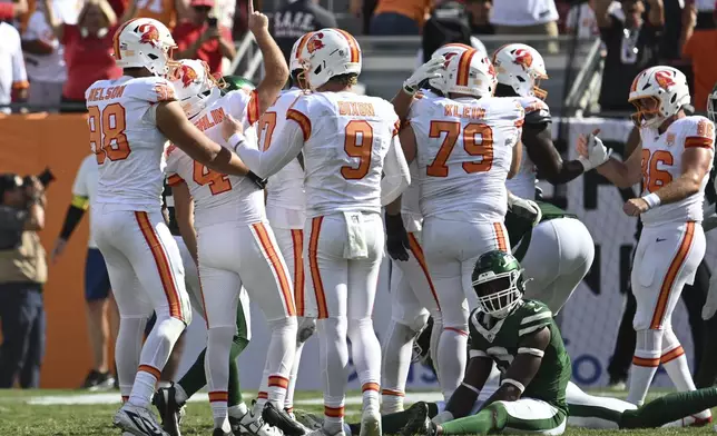 Tampa Bay Buccaneers kicker Chase McLaughlin (4) gestures after kicking a field goal to win the game during the end of the second half at an NFL football game against the New York Jets Sunday, Sept. 21, 2025, in Tampa, Fla. (AP Photo/Jason Behnken)