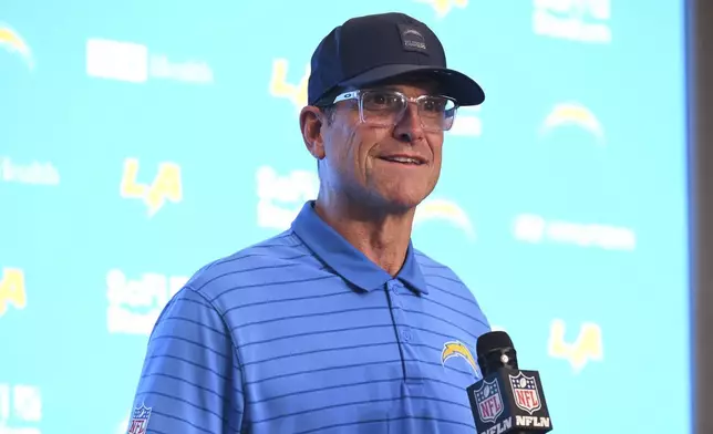 Los Angeles Chargers head coach Jim Harbaugh answers questions after an NFL football game against the Denver Broncos, Sunday, Sept. 21, 2025, in Inglewood, Calif. (AP Photo/Carrie Giordano)