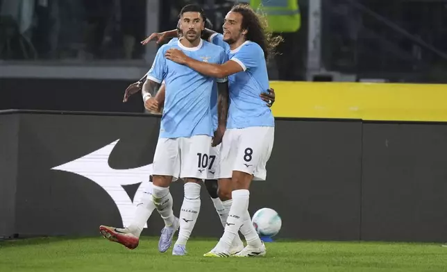 Lazio's Mattia Zaccagni, left, celebrates with his teammates after he scored his side's second goal during a Serie A soccer match between Lazio and Hellas Verona, at Rome's Olympic Stadium, Sunday, Aug. 31, 2025. (AP Photo/Andrew Medichini)