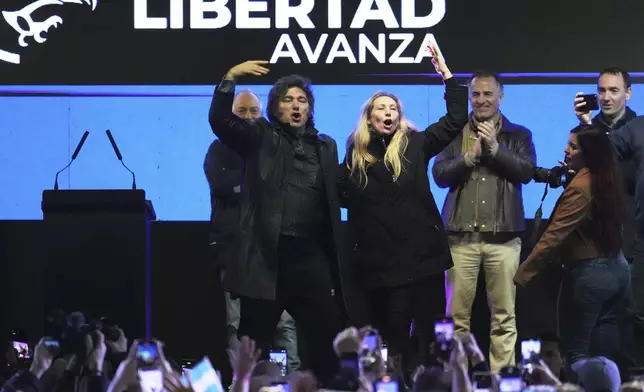 President Javier Milei, left, and his sister, General Secretary of the Presidency Karina Milei, gesture at supporters during a campaign rally ahead of legislative provincial elections, in Moreno, Buenos Aires province, Argentina, Wednesday, Sept. 3, 2025. (AP Photo/Natacha Pisarenko)