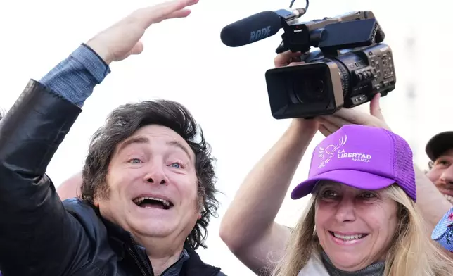 Argentine President Javier Milei and his sister, Secretary General of the Presidency, Karina Milei attend a rally ahead of legislative provincial elections in Lomas de Zamora, Argentina, Wednesday, Aug. 27, 2025. (AP Photo/Natacha Pisarenko)