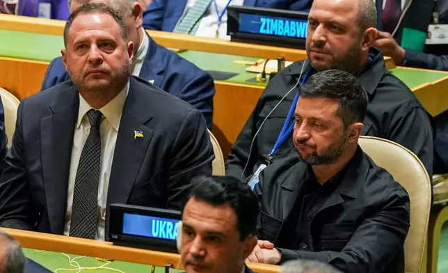 Ukraine President Volodymyr Zelenskyy listens as President Donald Trump addresses the 80th session of the United Nations General Assembly, Tuesday, Sept. 23, 2025, at UN headquarters. (AP Photo/Angelina Katsanis)