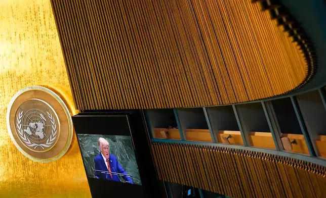President Donald Trump appears on a screen inside the General Assembly Hall as he addresses the 80th session of the United Nations General Assembly, Tuesday, Sept. 23, 2025, at U.N. headquarters. (AP Photo/Yuki Iwamura)