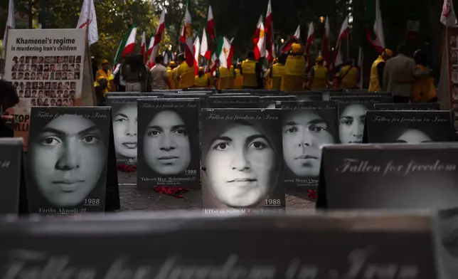 The faces of people activists say were killed by the government in Iran are displayed during a rally during the 80th session of the United Nations General Assembly, Tuesday, Sept. 23, 2025, in New York. (AP Photo/Heather Khalifa)