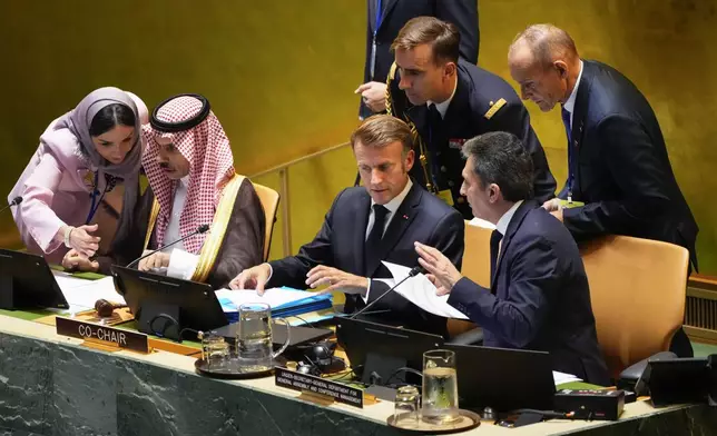 French President Emmanuel Macron, center, prepares to speak during a high-profile meeting at the United Nations aimed at galvanizing support for a two-state solution to the Israeli-Palestinian conflict Monday, Sept. 22, 2025, at UN headquarters. (AP Photo/Yuki Iwamura)