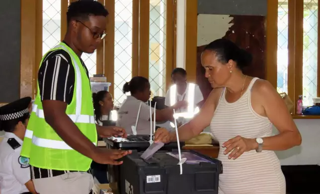 A woman casts her vote at Bel Eau Primary School, Bel Air, Seychelles, on Saturday, Sep. 27, 2025. (AP Photo/Emilie Chetty)