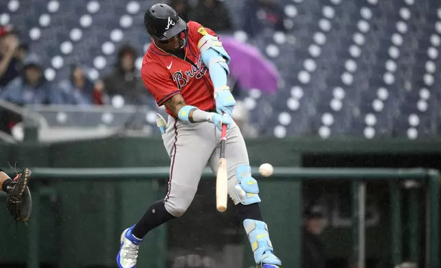 Atlanta Braves' Ronald Acuña Jr. singles during the ninth inning of the first baseball game of a doubleheader against the Washington Nationals, Tuesday, Sept. 16, 2025, in Washington. (AP Photo/Nick Wass)