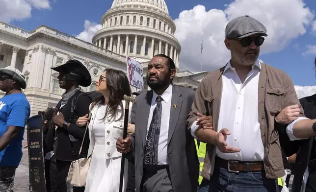 Rep. Al Green, D-Texas, center, marches with demonstrators protesting against President Donald Trump's use of federal law enforcement and National Guard troops in Washington during a protest at the U.S. Capitol, Tuesday, Sept. 2, 2025. (AP Photo/Jose Luis Magana)