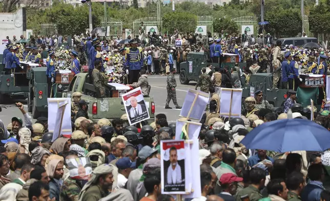 Coffins of Houthi Prime Minister Ahmed al-Rahawi and other officials killed in Israeli airstrikes on Thursday are carried on military vehicles during a funeral procession in Sanaa, Yemen, Monday, Sept. 1, 2025. (AP Photo/Osamah Abdulrahman)