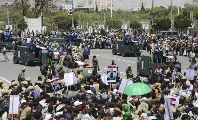 Coffins of Prime Minister Ahmed al-Rahawi and other officials killed in Israeli airstrikes on Thursday, are carried on military vehicles during a funeral procession in Sanaa, Yemen, Monday, Sept. 1, 2025. (AP Photo/Osamah Abdulrahman)
