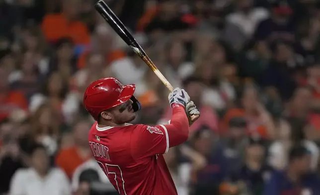 Los Angeles Angels designated hitter Mike Trout doubles during the eighth inning of a baseball game against the Houston Astros in Houston, Sunday, Aug. 31, 2025. (AP Photo/Ashley Landis)