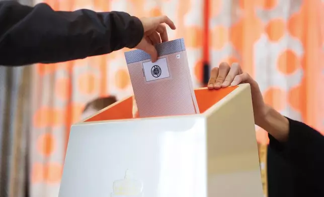 A voter casts his vote at Norway’s Parliamentary elections in Oslo, Norway, Monday, Sept. 8, 2025. (Javad Parsa/NTB Scanpix via AP)