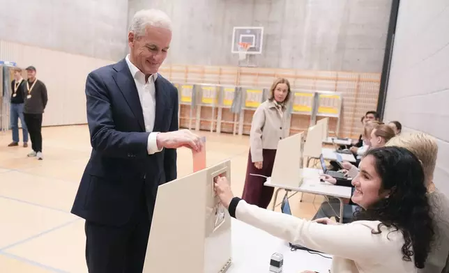 Labor Party leader Jonas Gahr Store casts his vote at Norway’s Parliamentary elections in Oslo, Norway, Monday, Sept. 8, 2025. (Javad Parsa/NTB Scanpix via AP)
