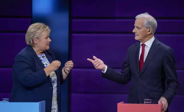 Erna Solberg chairwoman of Norway's Hoyre party, left, and Jonas Gahr Store, right, chairman of Norway's Ap party during a tv debate in Oslo, Norway, Tuesday, Sept. 2, 2025. (Stian Lysberg Solum/NTB Scanpix via AP)