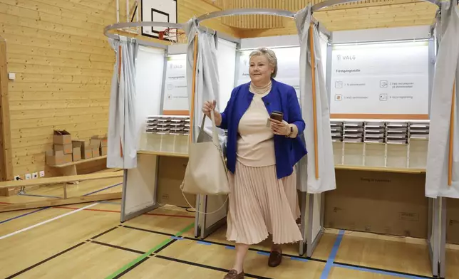 Hoyre Party leader Erna Solberg casts her vote at Norway’s Parliamentary elections in Bergen, Norway, Monday, Sept. 8, 2025. (Silje Katrine Robinson/NTB Scanpix via AP)