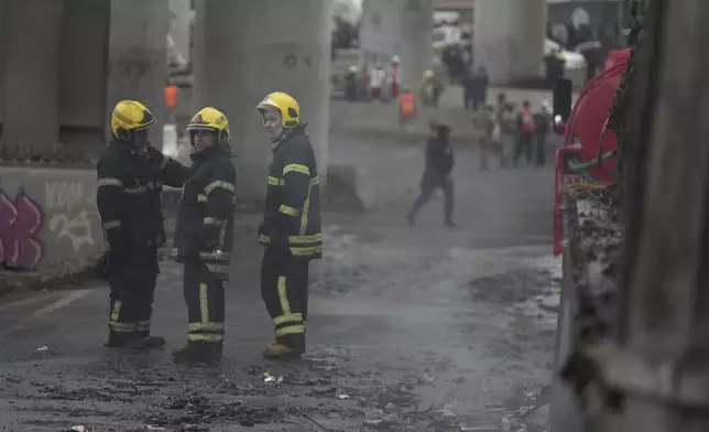 Firefighters work the scene following a gas tank explosion in Mexico City, Wednesday, Sept. 10, 2025. (AP Photo/Fernando Llano)