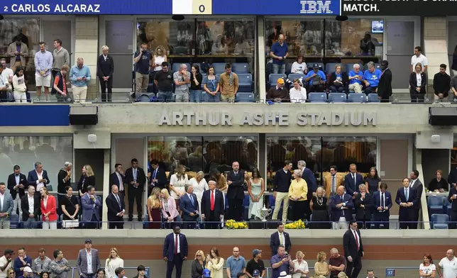 President Donald Trump talks with Steve Witkoff before the start of the the men's singles final of the U.S. Open tennis championships, Sunday, Sept. 7, 2025, in New York. (AP Photo/Yuki Iwamura)