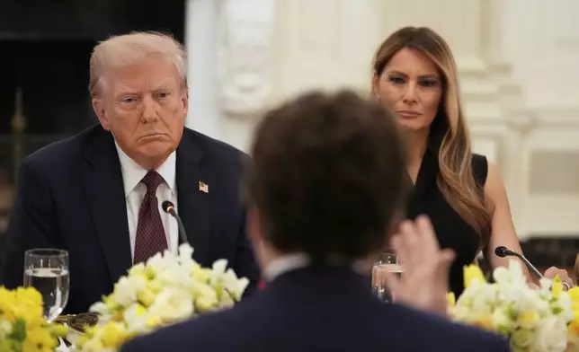 President Donald Trump and first lady Melania Trump listen during a dinner in the State Dining Room of the White House, Thursday, Sept. 4, 2025, in Washington. (AP Photo/Alex Brandon)