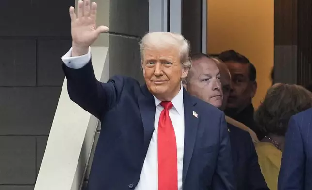 President Donald Trump waves as he arrives at the US Open tennis men's singles final Sunday, Sept. 7, 2025, in Flushing, N.Y. (AP Photo/Manuel Balce Ceneta)