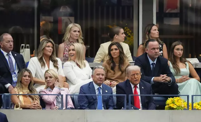 President Donald Trump, joined by Steve Witkoff, U.S. Attorney General Pam Bondi, Karoline Leavitt, White House press secretary, Lindsey Halligan, White House Deputy Chief of Staff, Dan Scavino, and Arabella Kushner, watches play between Carlos Alcaraz, of Spain, and Jannik Sinner, of Italy, during the men's singles final of the U.S. Open tennis championships, Sunday, Sept. 7, 2025, in New York. (AP Photo/Yuki Iwamura)