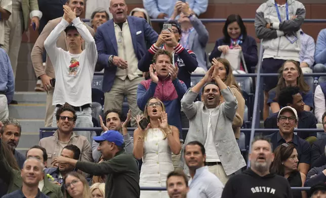 Fans react to President Donald Trump during the men's singles final of the U.S. Open tennis championships, Sunday, Sept. 7, 2025, in New York. (AP Photo/Seth Wenig)