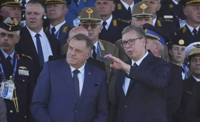 Serbian President Aleksandar Vucic, right, and Bosnian Serb leader Milorad Dodik attend a military parade in Belgrade, Serbia, Saturday, Sept. 20, 2025. (AP Photo/Darko Vojinovic)