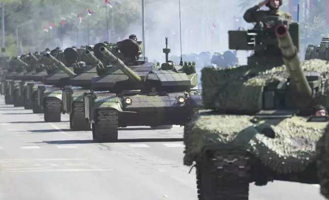 Serbian Army soldiers perform during a military parade in Belgrade, Serbia, Saturday, Sept. 20, 2025. (AP Photo/Darko Vojinovic)