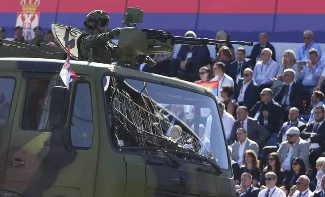 Serbian Army soldiers perform during a military parade in Belgrade, Serbia, Saturday, Sept. 20, 2025. (AP Photo/Darko Vojinovic)