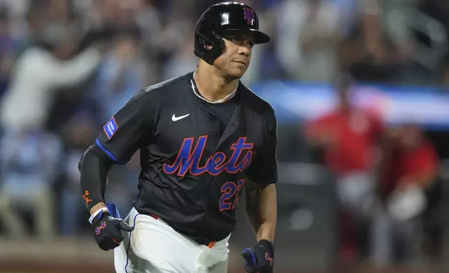 New York Mets' Juan Soto runs the bases after hitting a three-run home run during the fourth inning of a baseball game against the Washington Nationals Friday, Sept. 19, 2025, in New York. (AP Photo/Frank Franklin II)