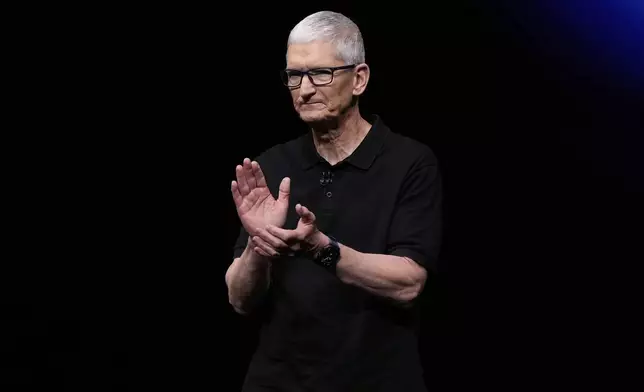 Apple CEO Tim Cook applauds on stage during an announcement of new products at Apple Park on Tuesday, Sept. 9, 2025, in Cupertino, Calif. (AP Photo/Godofredo A. Vásquez)