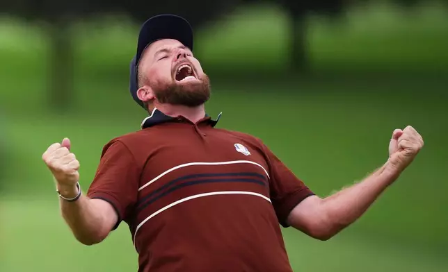 Europe's Shane Lowry react after their match win on the 18th hole at Bethpage Black golf course during the Ryder Cup golf tournament, Saturday, Sept. 27, 2025, in Farmingdale, N.Y. (AP Photo/Matt Slocum)