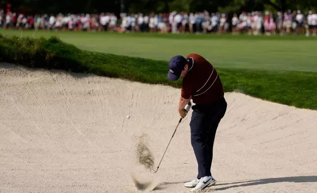 Europe's Robert MacIntyre hits from the bunker on the 13th hole at Bethpage Black golf course during the Ryder Cup golf tournament, Saturday, Sept. 27, 2025, in Farmingdale, N.Y. (AP Photo/Seth Wenig)
